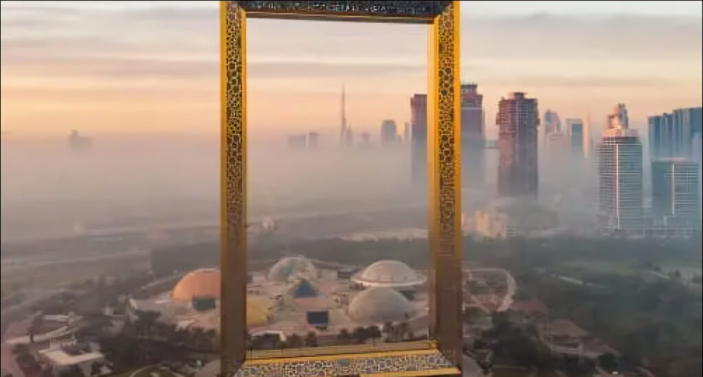 Scenic view of the iconic Dubai Frame at sunrise, overlooking the city skyline and modern architecture.