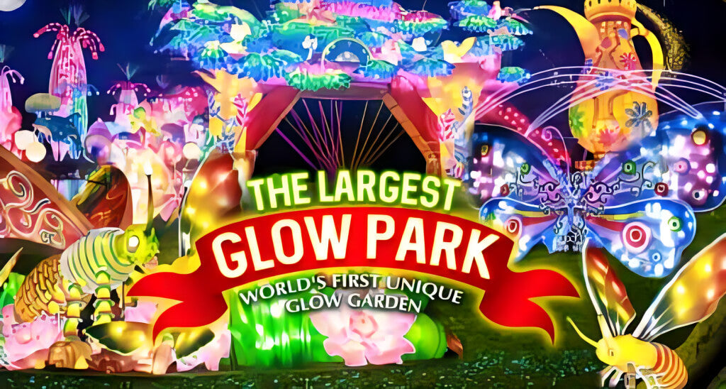 Entrance display at Dubai Glow Garden showcasing colorful illuminated sculptures and signage for the world’s largest glow park.