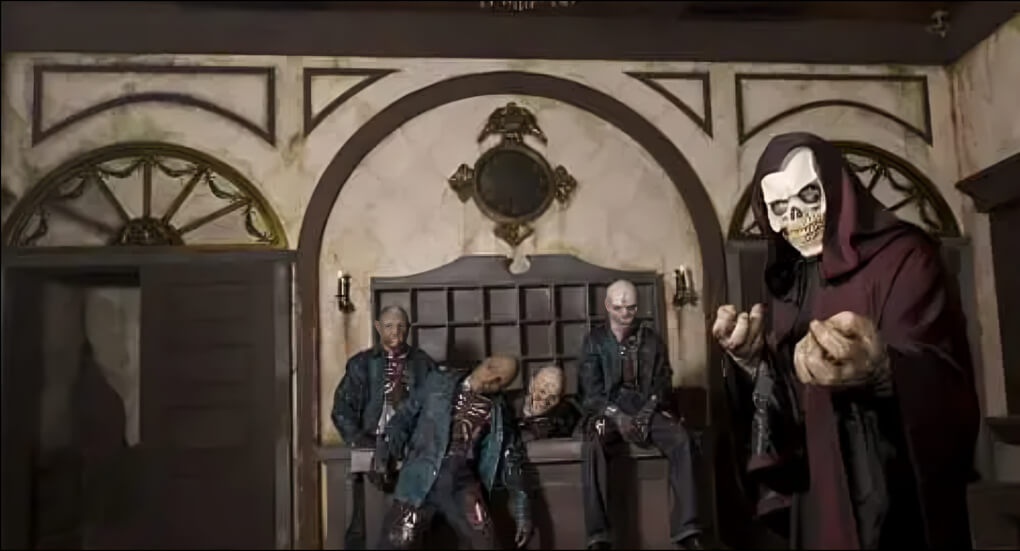 Haunted attraction scene with creepy skeleton figures and eerie decor inside IMG Worlds of Adventure Dubai’s horror zone.