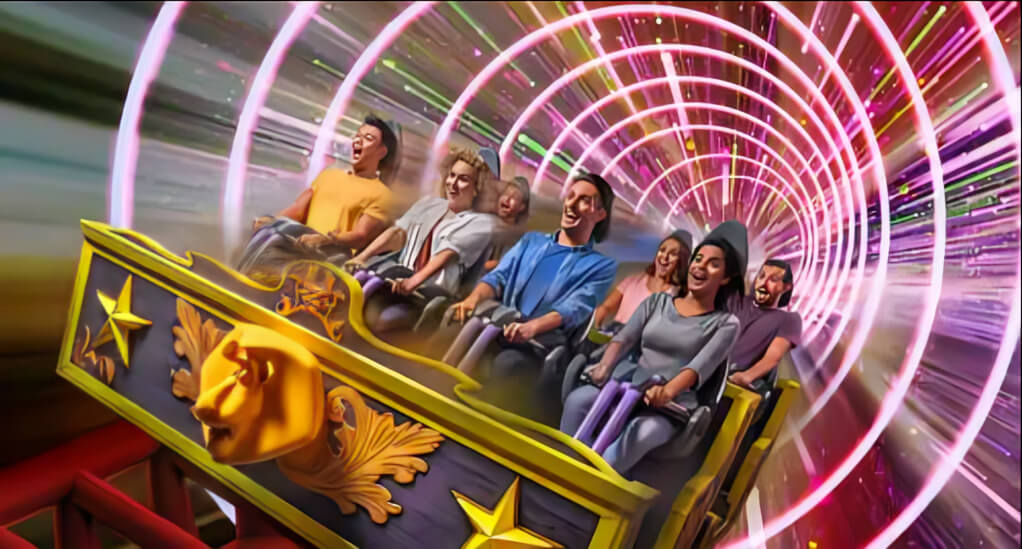 Thrilled riders on a colorful roller coaster inside a glowing tunnel at Motiongate Dubai, experiencing high-speed excitement and immersive lights.